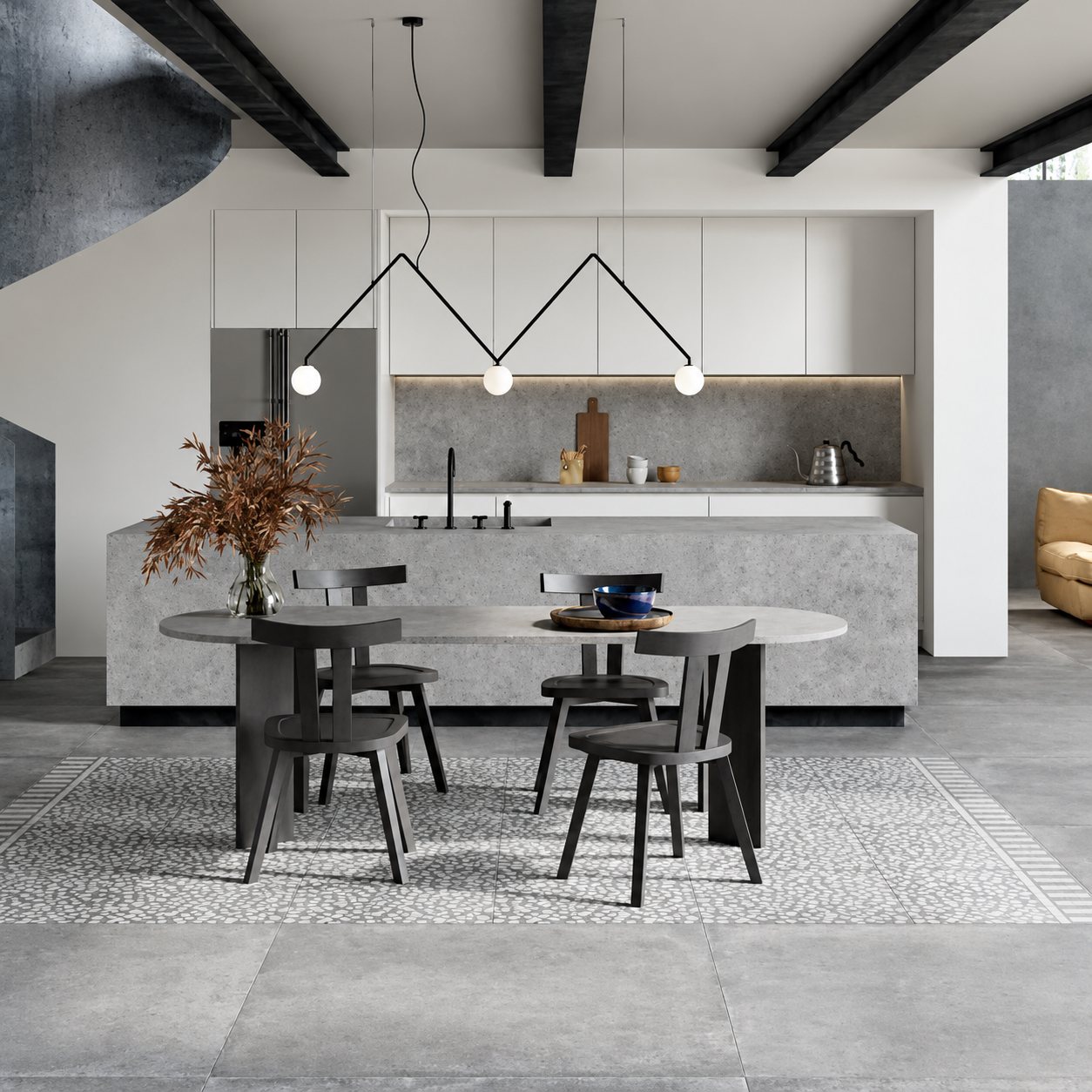 Intérieur contemporain aux tons gris avec une cuisine blanche, un îlot effet pierre, une table ovale entourée de chaises sombres et un sol en carrelage à motif galets.